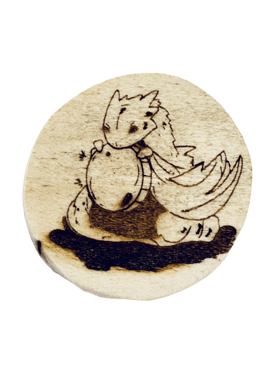 Book Dragon laser engraved wood coin — finished product